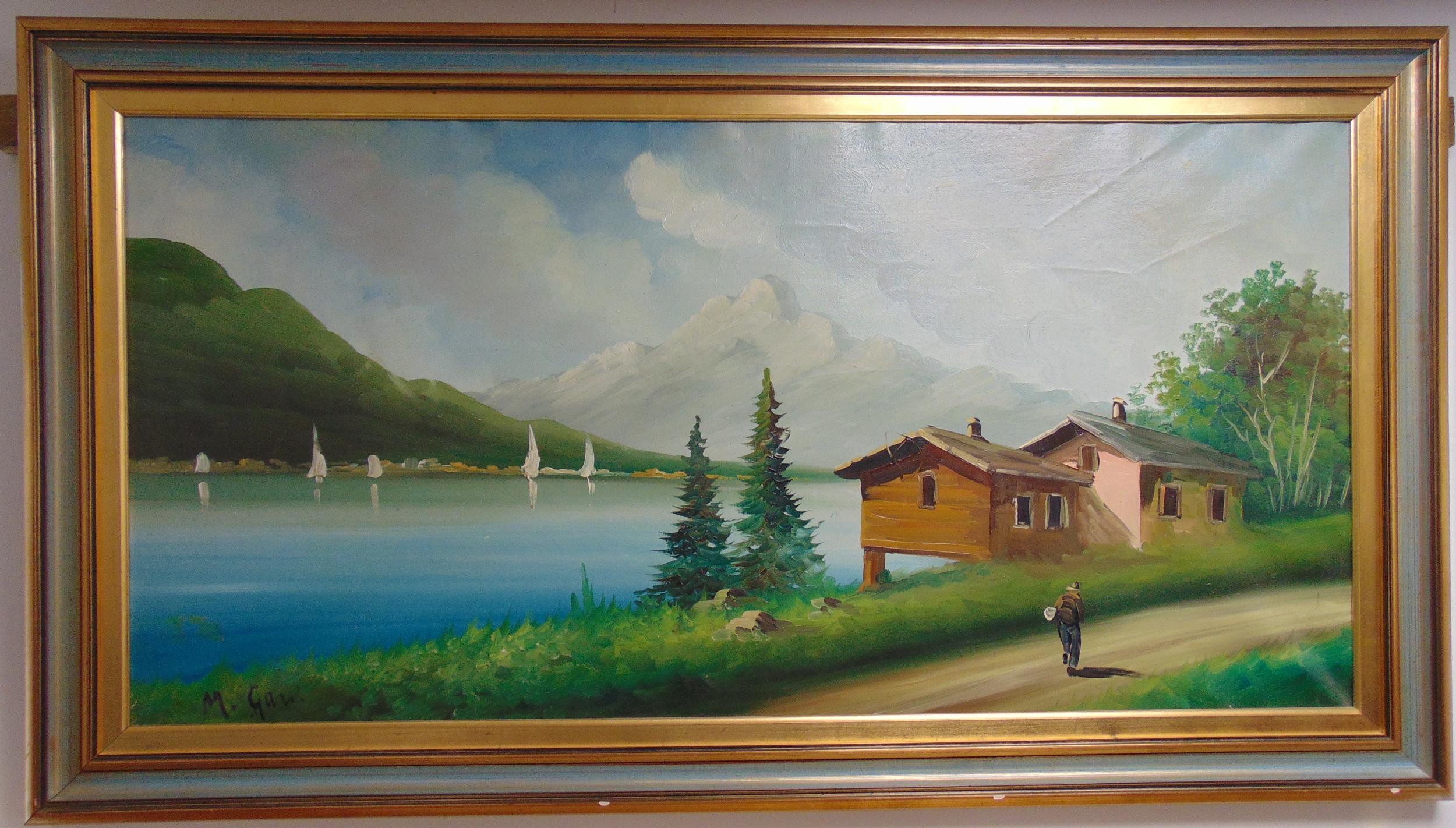 A framed oil on canvas of a Swiss lake and mountain scene with a cottage and road in the foreground,