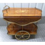A Sorrento shaped rectangular wooden hostess trolley with two wheels and scroll handles