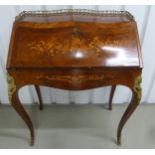 A French style Kingswood rectangular inlaid bureau with tooled leather desk, drawers and gilded