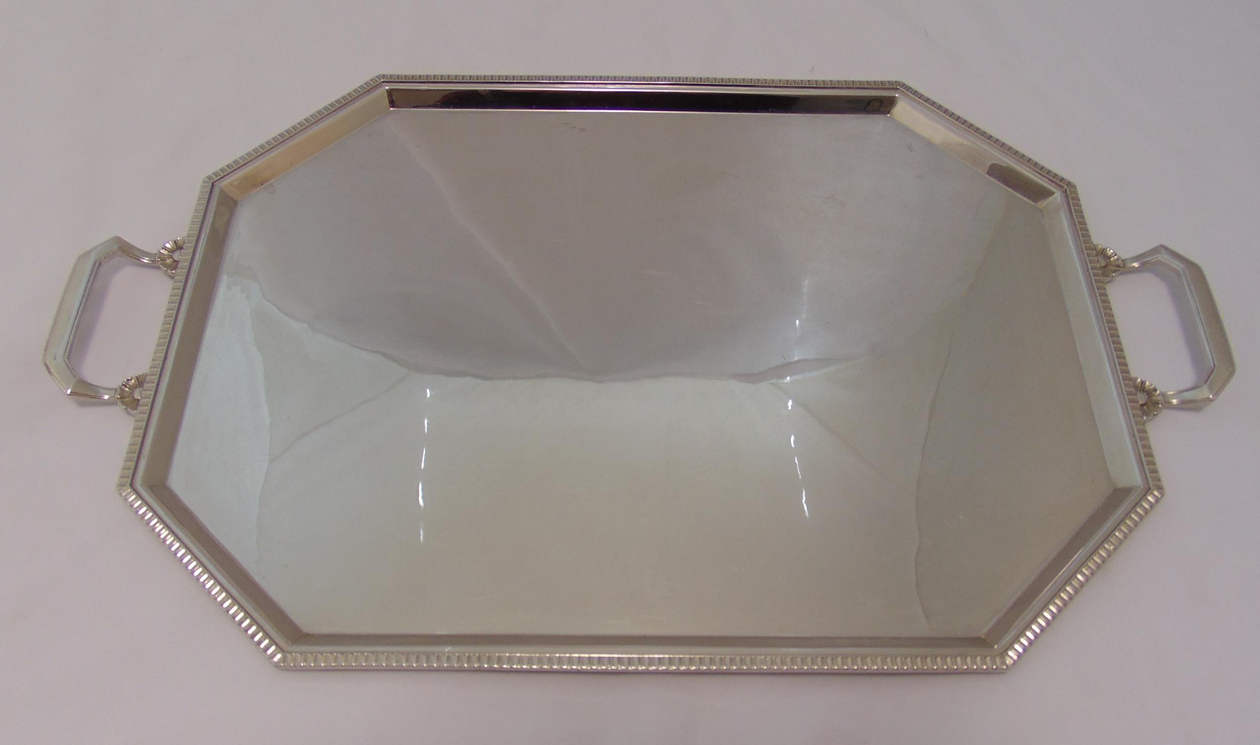 A Mappin and Webb hallmarked silver tea tray elongated octagonal form with gadrooned borders and two