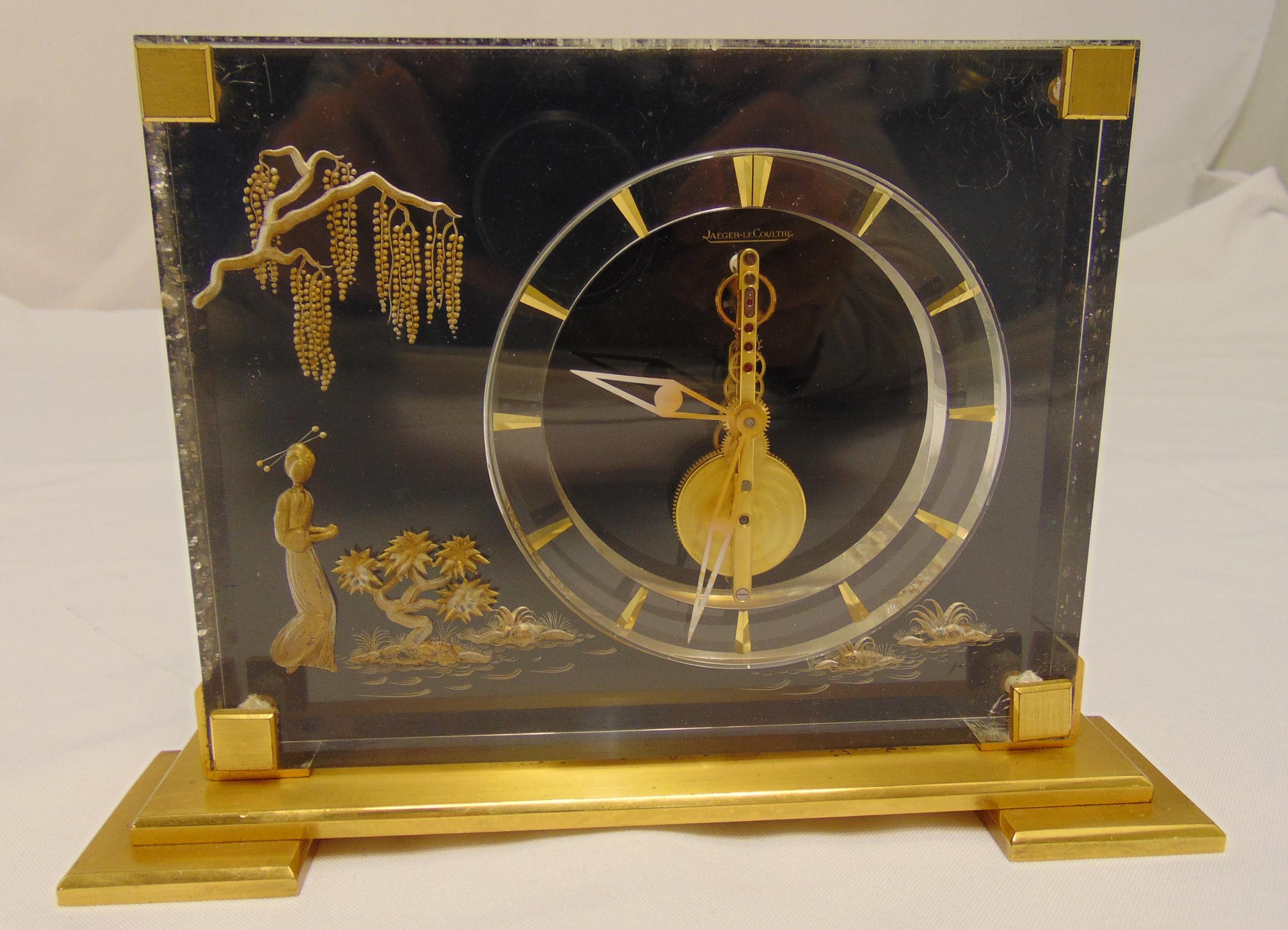 Jaeger LeCoultre rectangular gilt bronze and lucite Chinoserie style mantle clock on raised