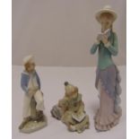 Three Lladro figurines to include a young boy with a boat, a lady reading, and a clown reading a