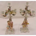 A pair of Sitzendorf five light candelabra the figural stems representing the four seasons and