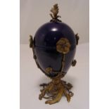 A continental egg shaped ceramic vase and cover with ormolu naturalistic mounts 38cm (h)