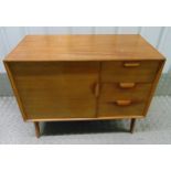 A mid 20th century rectangular teak sideboard with three drawers and a cupboard on four tubular