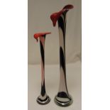 Two Murano glass long stem vases of tubular form on circular spreading bases decorated to the