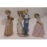 Three Lladro figurines of children in various poses, tallest 20cm (h)