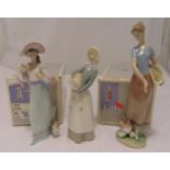 Three Lladro figurines of ladies in various poses to include 6246, 06370 and a lady holding a