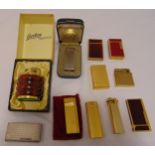 A quantity of vintage lighters to include Dunhill, Cartier, DuPont and Calibri (11)