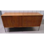 A 1960s rectangular sideboard with three drawers and one cupboard on tubular metal legs, 70.5 x