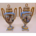 A pair of Vienna vases and covers decorated with classical scenes, gilded side handles and raised