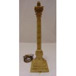 A wooden Corinthian column lamp base decorated with flowers and leaves on stepped square base,