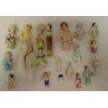 Eighteen ceramic half dolls of varying size and style