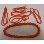 Five coral bead necklaces and an amber bead necklace