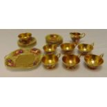 An Aynsley Orchard Gold tea service to include cups, saucers, side plates, a sandwich plate, a