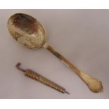 A Queen Anne hallmarked silver trefid spoon, London 1710 and novelty needle case