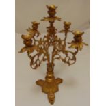 A gilded metal five light candelabrum on triform base, 48.5cm (h)