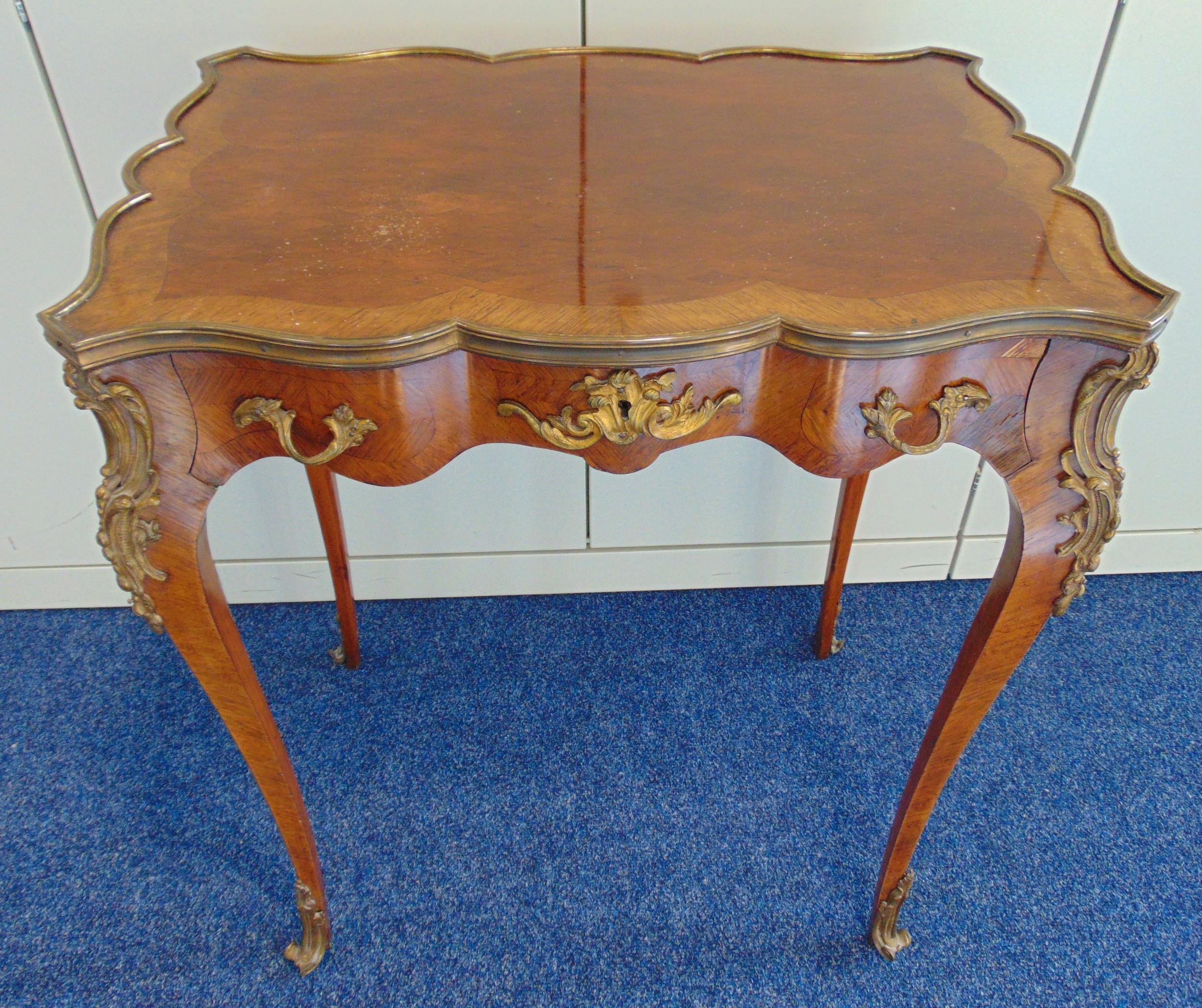 A French style Kingswood rectangular hall table with brass mounts, a single drawer on four
