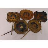 Five Regency and early Victorian papier mache and wooden hand held fire screens, decorated in