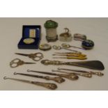 A quantity of collectables to include patch boxes, button hooks with silver handles and a pin