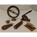 A quantity of collectables to include a powder flask, a naval telescope, a seal and paperweights (