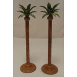 A pair of pricket coloured metal candlesticks in the form of palm trees, 42cm (h)