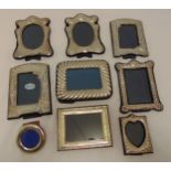 Nine hallmarked silver mounted photograph frames of varying size and style