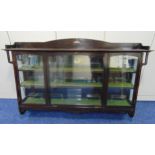 An early 20th century rectangular and glazed mahogany Goss cabinet with applied ceramic Goss shield,