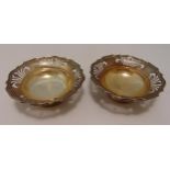 A pair of hallmarked silver bonbon dishes, pierced sides on circular spreading bases, approx total
