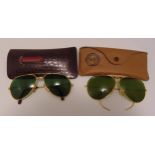 A pair of Cartier sunglasses and a pair of Rayban sunglasses in original case