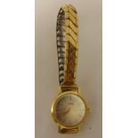 Huber 9ct gold ladies wristwatch on a gold plated expanding bracelet