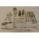 A quantity of hallmarked silver and white metal to include condiments, tongs, flatware and knife