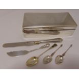 A quantity of hallmarked silver to include a cigarette box, three teaspoons and two knives