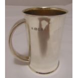 A hallmarked silver Christening mug, cylindrical with D form handle, London 1934, approx total