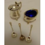 A quantity of hallmarked silver to include a salt, a mustard pot and three condiment spoons,