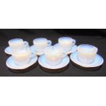 A set of six Murano Effetre opalescent coffee cups and saucers