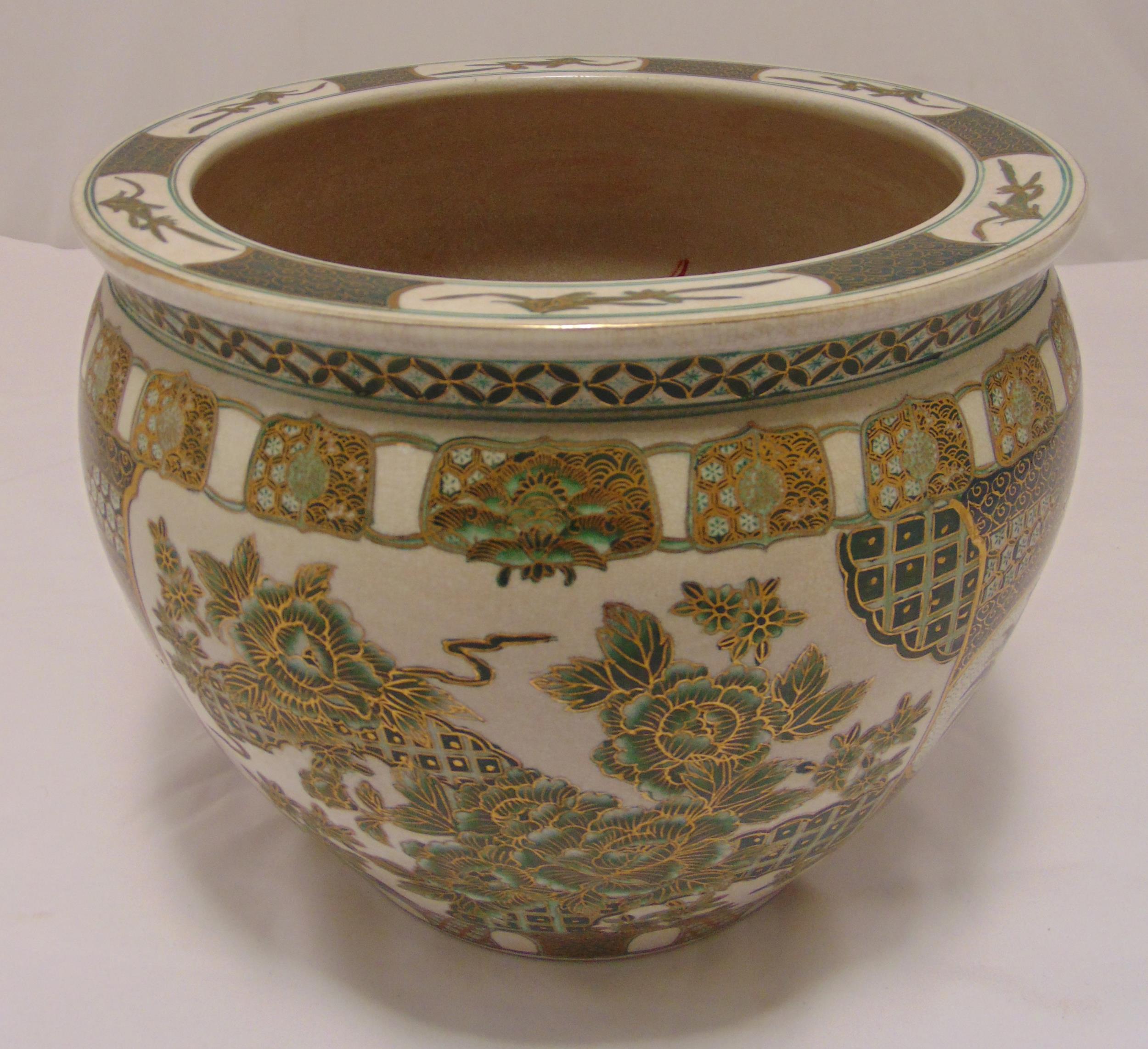 A Chinese fish bowl decorated to the sides with stylised flowers and leaves, 30cm (h)