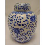 A Chinese blue and white ginger jar and cover, ovoid form decorated with stylised flowers and