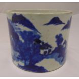 A Chinese blue and white brush pot decorated with a landscape and Chinese characters, six