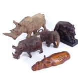 A group of carved hardwood animals, including rhino and boar, largest length 32cm (5)