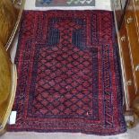 A red ground Beluchi prayer rug, 123cm x 94cm