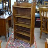 A 1920s oak open bookcase, W60cm, H120cm, D20cm, shelf depth 18cm