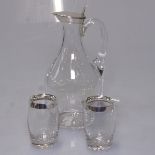 A glass oil jar with silver lid, and a pair of barrel shaped glass pots with silver rims