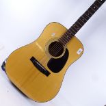 A Grand Suzuki acoustic guitar, with fitted case