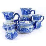 A graduated set of 4 reproduction blue and white jugs, tallest 24cm, and similar reproduction teapot