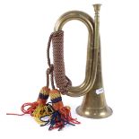 An early 20th century brass bugle, with original rope, length 29cm