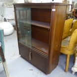 A teak round-cornered display cabinet with sliding glazed doors, W103cm, H134cm