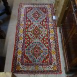 A red ground Beluchi rug, 160cm x 80cm