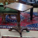 A William IV mahogany lamp table, with rectangular top, turned centre column and platform base,