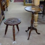 A chip carved oak stool, and a mahogany tripod table